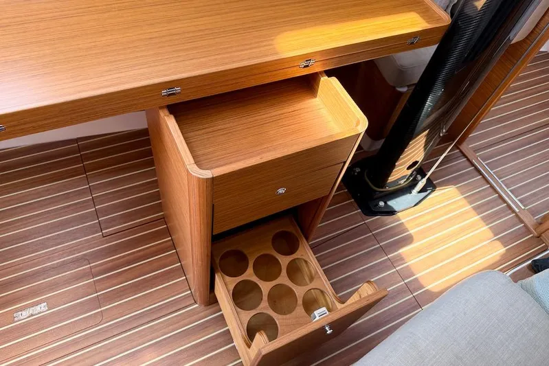 Spectre Yacht Photos Pics Interior of 2016 X-Yachts Xp38 showing wooden cabinetry and flooring with open storage.