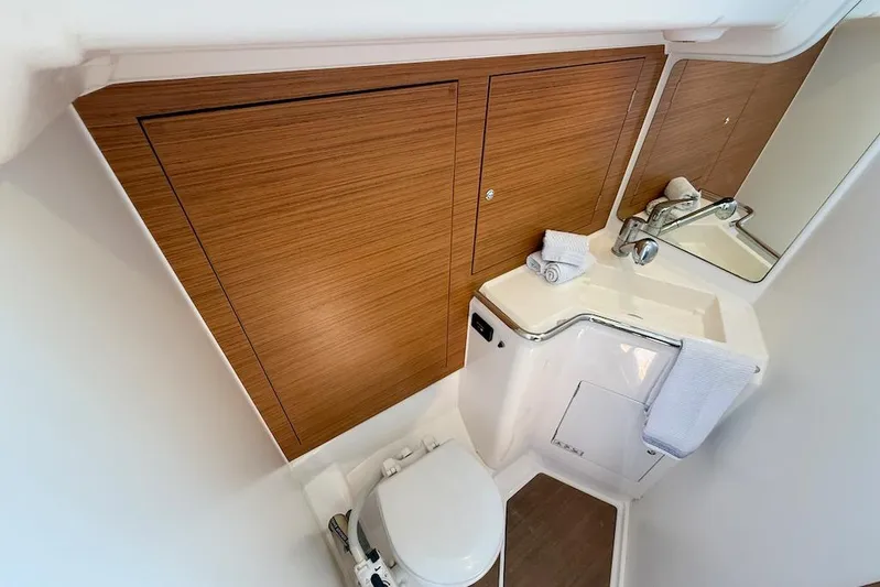 Spectre Yacht Photos Pics 2016 X-Yachts Xp38 yacht bathroom with wooden cabinetry and modern fixtures.