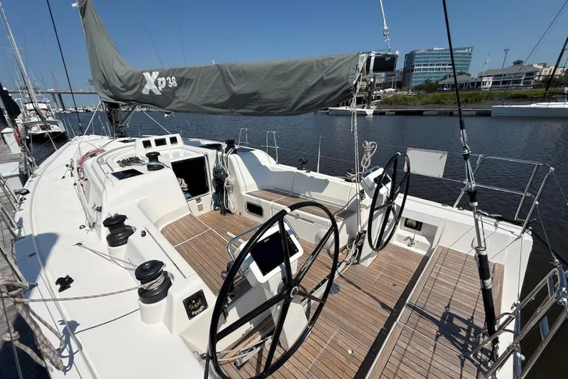 Spectre Yacht Photos Pics 2016 X-Yachts Xp38 sailboat with dual steering wheels, docked in a marina.