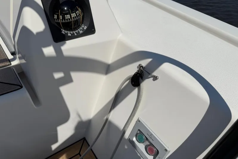 Spectre Yacht Photos Pics Cockpit detail of 2016 X-Yachts Xp38 sailboat with compass and control buttons.