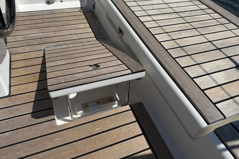 Spectre Yacht Photos Pics Teak deck detail of 2016 X-Yachts Xp38 sailboat, showcasing elegant wood finish.