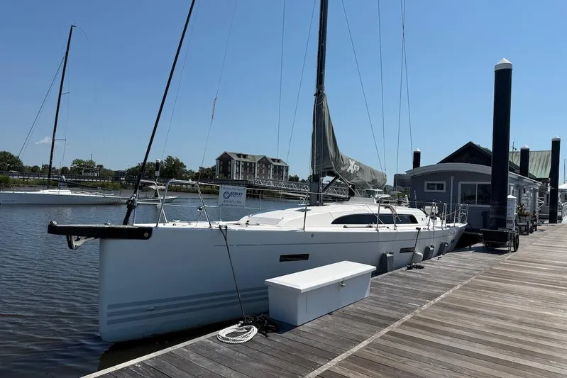 Spectre Yacht Photos Pics 2016 X-Yachts Xp38 sailboat docked at a marina under clear blue skies.