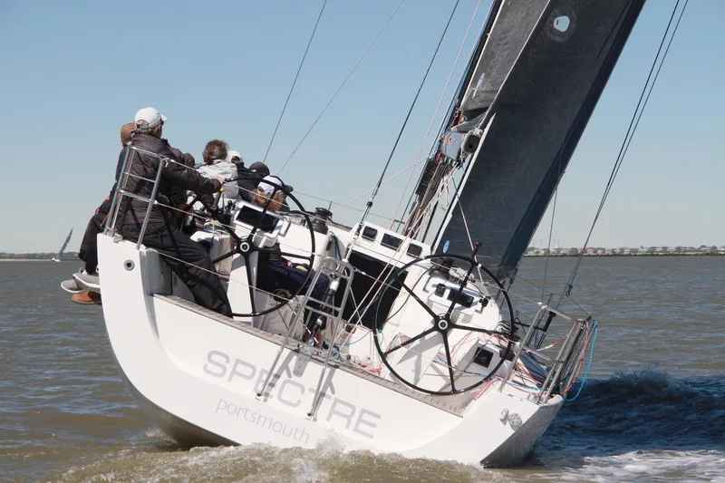 Spectre Yacht Photos Pics 2016 X-Yachts Xp38 sailboat racing on open water with crew onboard.