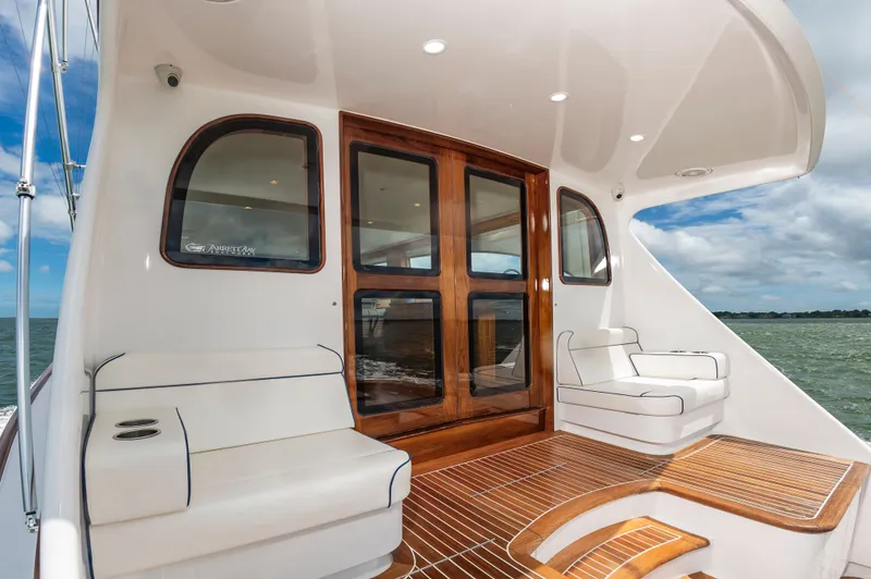 Privateer Yacht Photos Pics 2019 Jarrett Bay 67 Custom yacht with elegant wood finish and seating area.