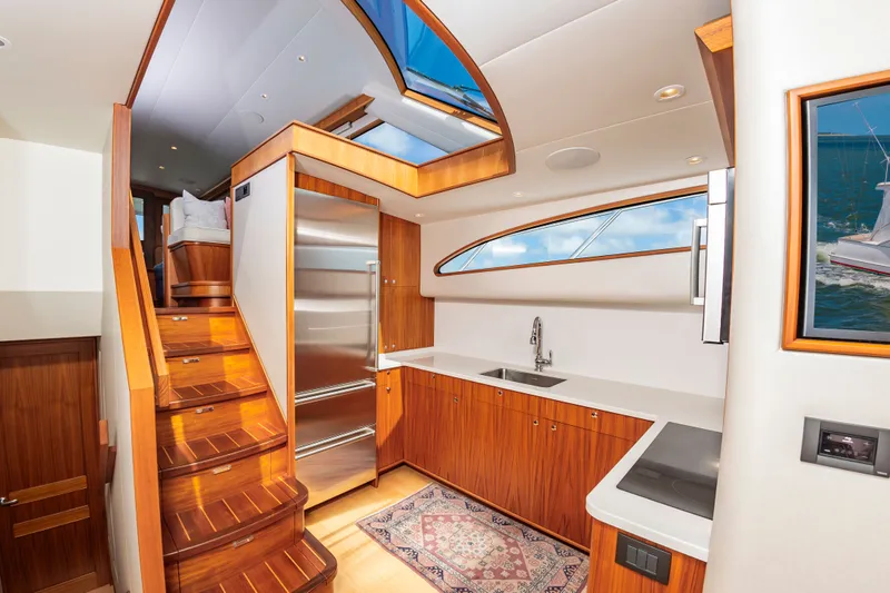 Privateer Yacht Photos Pics Interior of 2019 Jarrett Bay 67 Custom yacht, featuring modern kitchen and staircase.