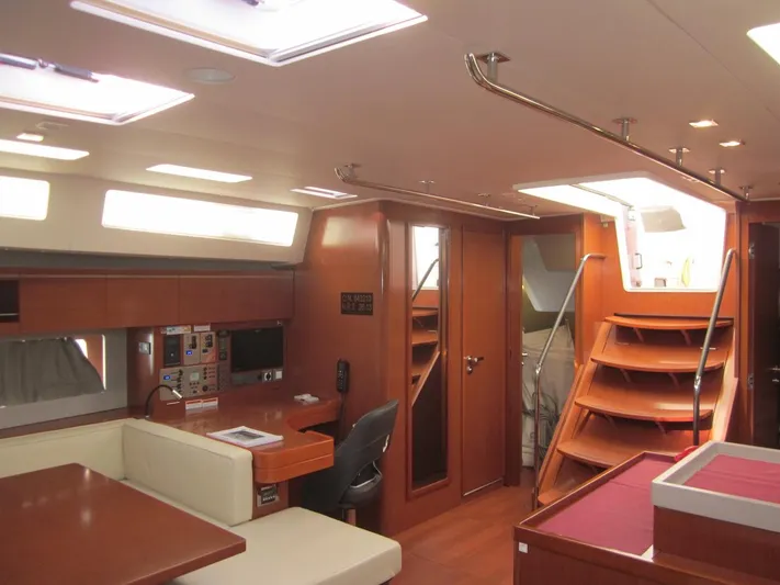 Cameli Yacht Photos Pics Luxurious interior of 2020 Beneteau Oceanis 55.1 yacht with modern furnishings and ample natural light.