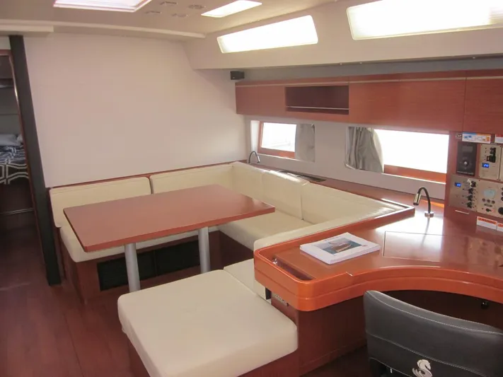 Cameli Yacht Photos Pics Luxurious interior of 2020 Beneteau Oceanis 55.1 yacht with elegant seating and modern design.