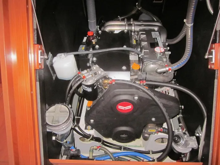 Cameli Yacht Photos Pics Engine compartment of a 2020 Beneteau Oceanis 55.1 sailboat, showcasing mechanical components.