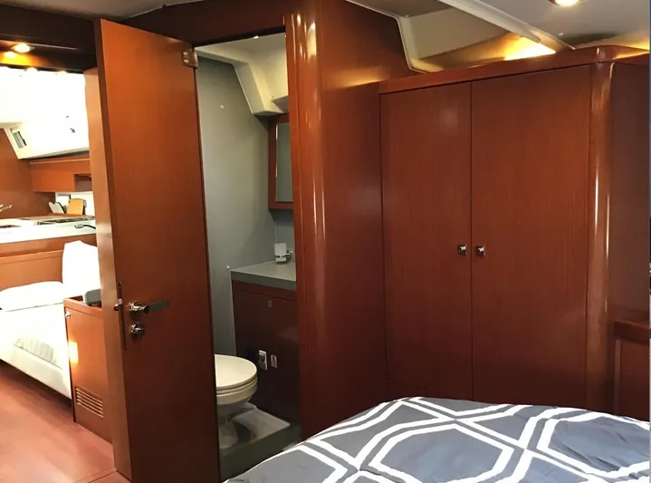 Cameli Yacht Photos Pics Luxurious interior of 2020 Beneteau Oceanis 55.1 yacht with wood finish and modern amenities.