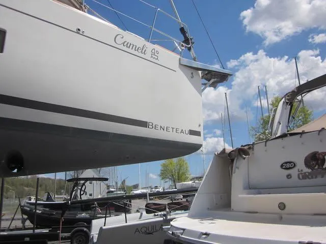 Cameli Yacht Photos Pics Beneteau Oceanis 55.1 sailboat in a marina, 2020 model, with clear blue sky.