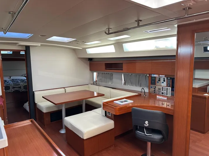 Cameli Yacht Photos Pics Interior of 2020 Beneteau Oceanis 55.1 yacht with modern seating and navigation area.