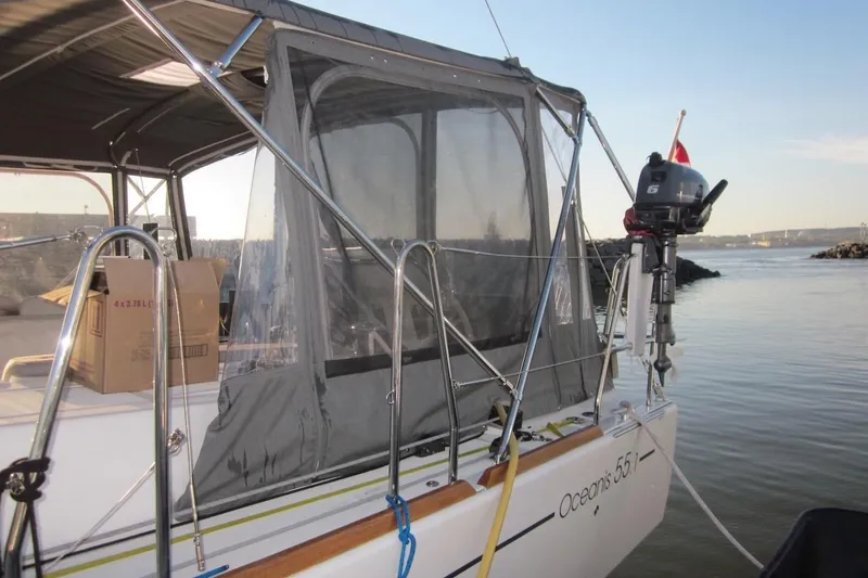 Cameli Yacht Photos Pics 2020 Beneteau Oceanis 55.1 yacht with motor, docked by calm waters.