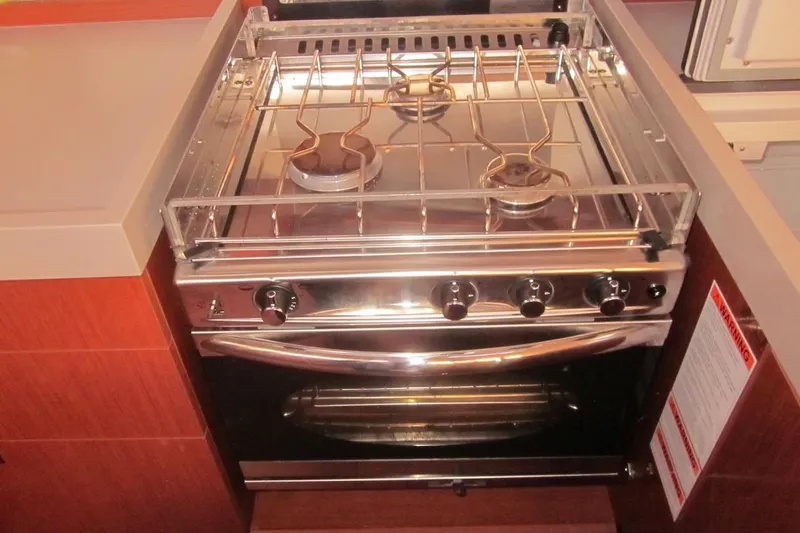 Cameli Yacht Photos Pics Stainless steel stove and oven in 2020 Beneteau Oceanis 55.1 yacht kitchen.