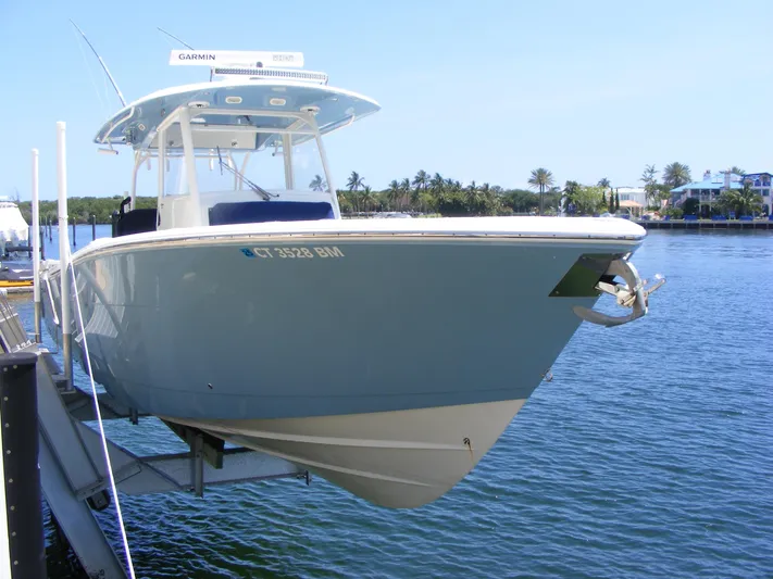  Yacht Photos Pics 2020 Cobia 350 Center Console boat docked on calm water.
