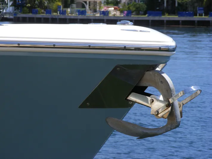  Yacht Photos Pics 2020 Cobia 350 Center Console boat with anchor, docked on calm water.