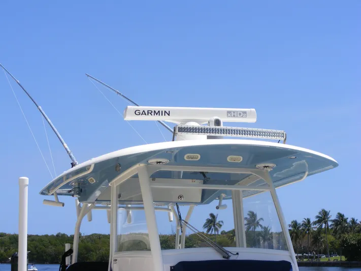  Yacht Photos Pics 2020 Cobia 350 Center Console boat with Garmin radar, blue sky background.