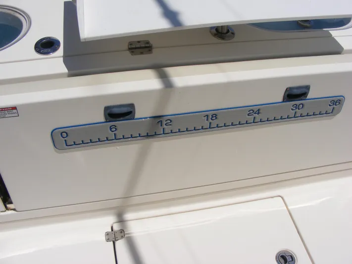  Yacht Photos Pics 2020 Cobia 350 Center Console boat with built-in measuring scale on deck.