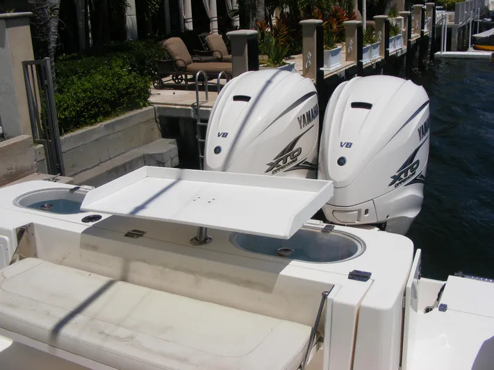  Yacht Photos Pics 2020 Cobia 350 Center Console with twin Yamaha V8 engines docked by the water.