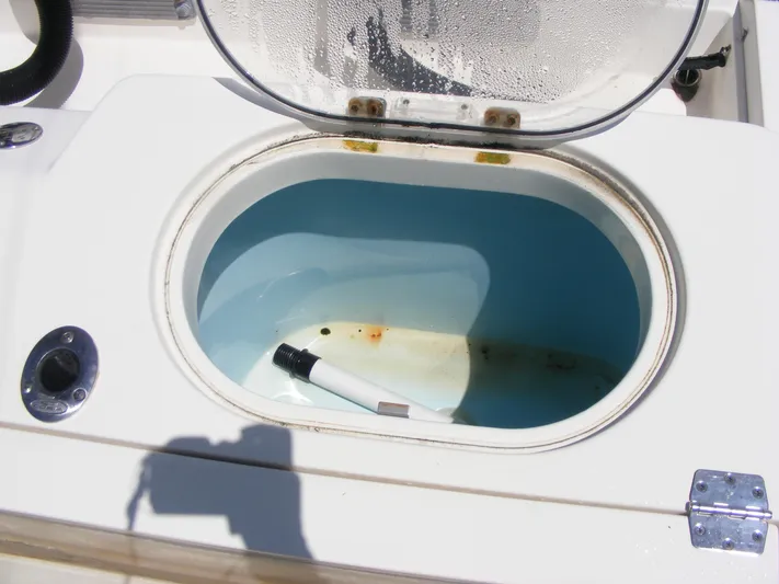  Yacht Photos Pics Open storage compartment on 2020 Cobia 350 Center Console boat.