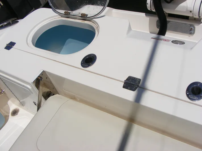  Yacht Photos Pics 2020 Cobia 350 Center Console boat deck with open storage compartment.