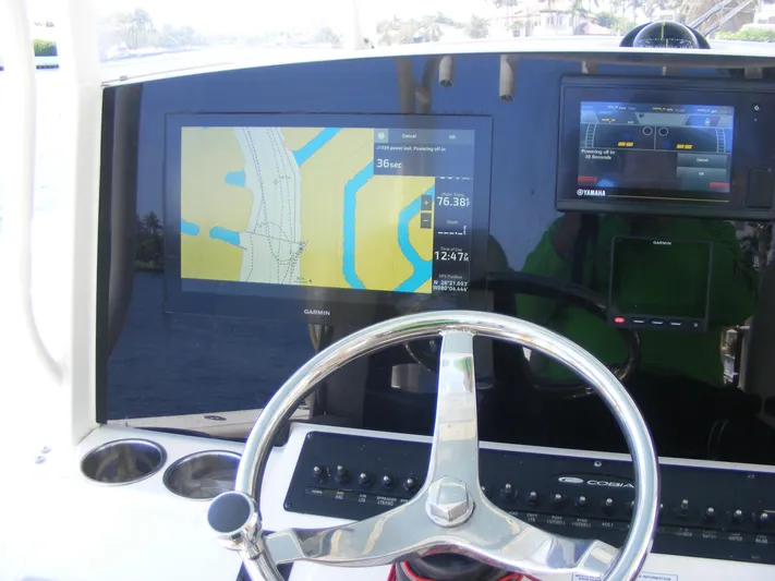  Yacht Photos Pics Steering wheel and navigation screens on 2020 Cobia 350 Center Console boat.