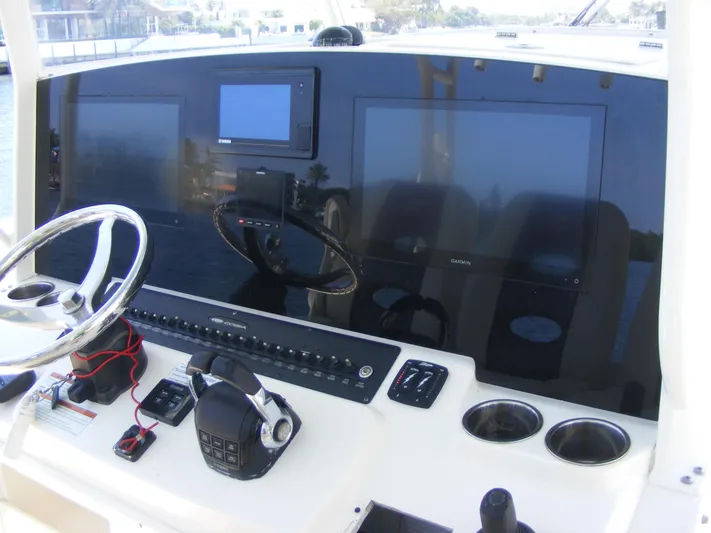  Yacht Photos Pics 2020 Cobia 350 Center Console dashboard with steering wheel and electronic displays.