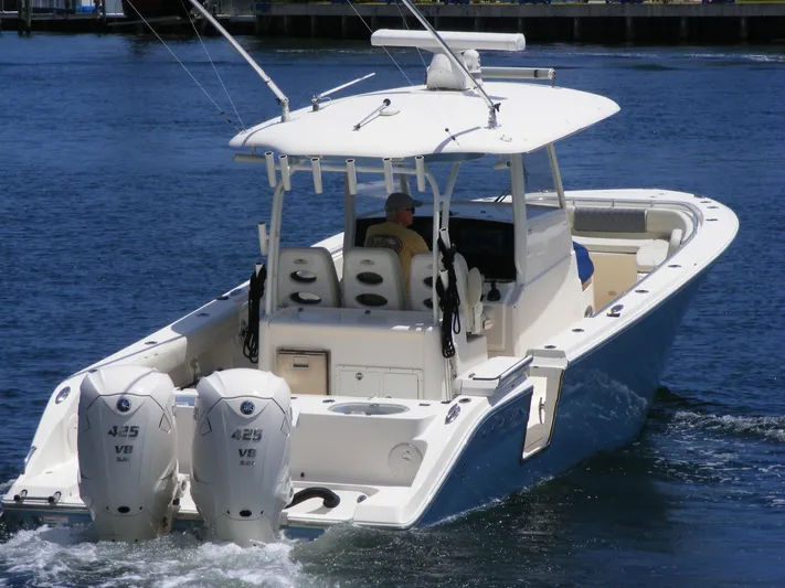  Yacht Photos Pics 2020 Cobia 350 Center Console boat with dual engines cruising on water.