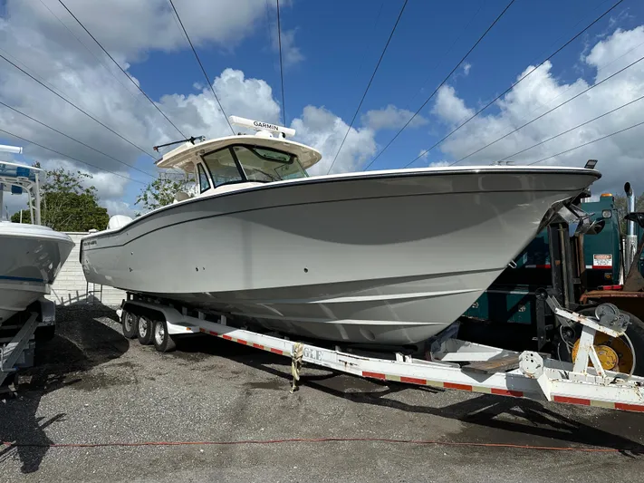  Yacht Photos Pics 2023 Grady-White Canyon 376 boat on trailer under blue sky.