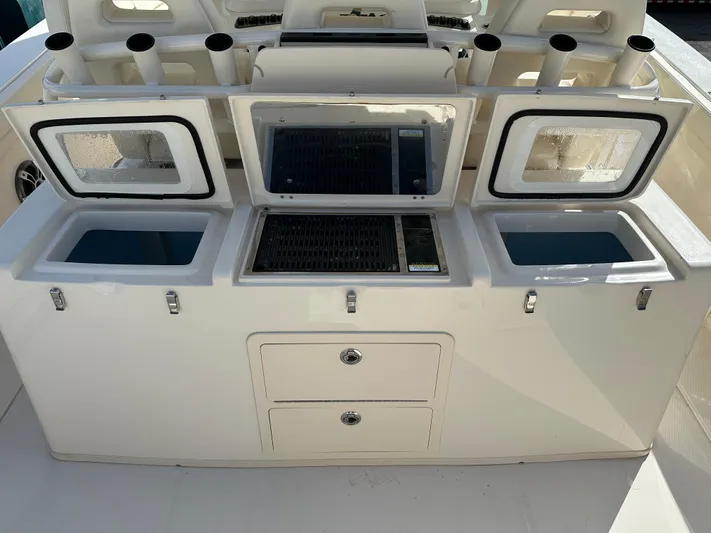  Yacht Photos Pics 2023 Grady-White Canyon 376 boat interior with storage compartments and rod holders.
