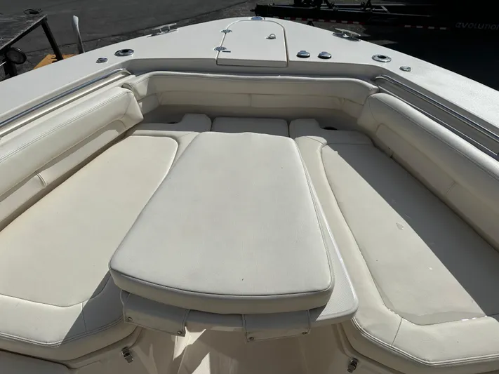  Yacht Photos Pics 2023 Grady-White Canyon 376 boat interior with cushioned seating area.