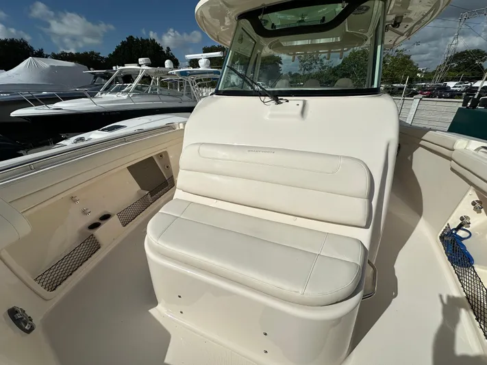  Yacht Photos Pics 2023 Grady-White Canyon 376 boat interior with cushioned seating and storage compartments.