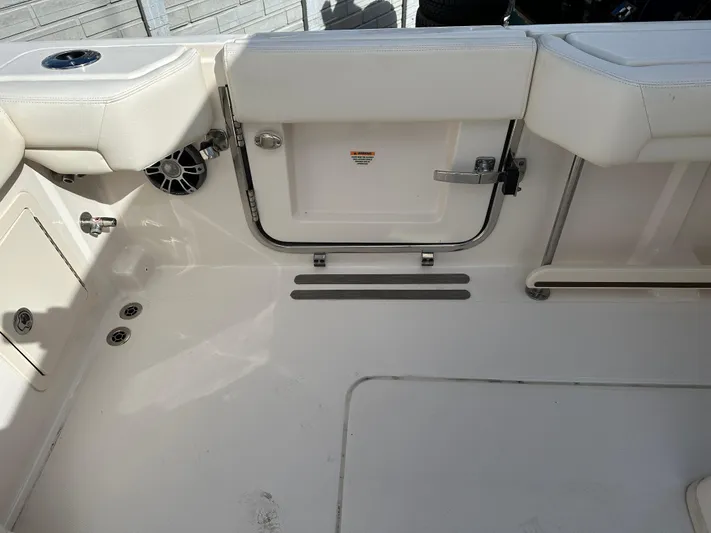  Yacht Photos Pics 2023 Grady-White Canyon 376 boat interior, featuring seating and storage compartments.