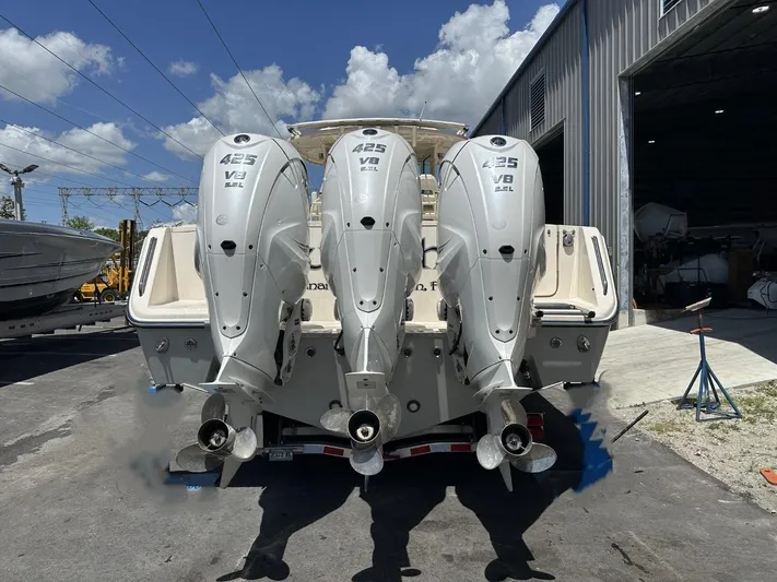  Yacht Photos Pics 2023 Grady-White Canyon 376 boat with triple 425 V8 engines at a marina.