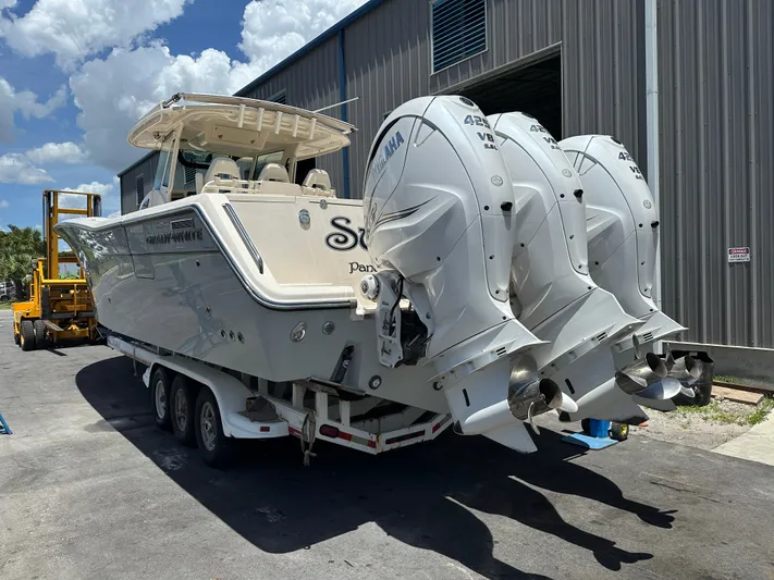  Yacht Photos Pics 2023 Grady-White Canyon 376 boat with triple Yamaha 425 engines on a trailer.