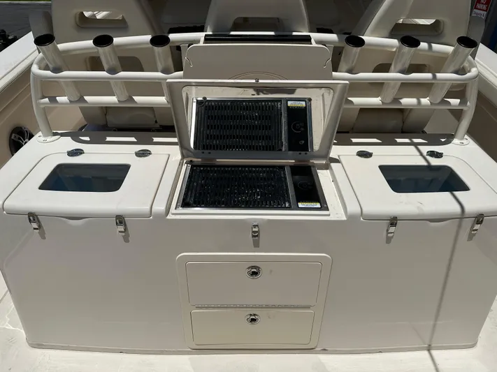  Yacht Photos Pics 2023 Grady-White Canyon 376 boat with fishing rod holders and storage compartments.