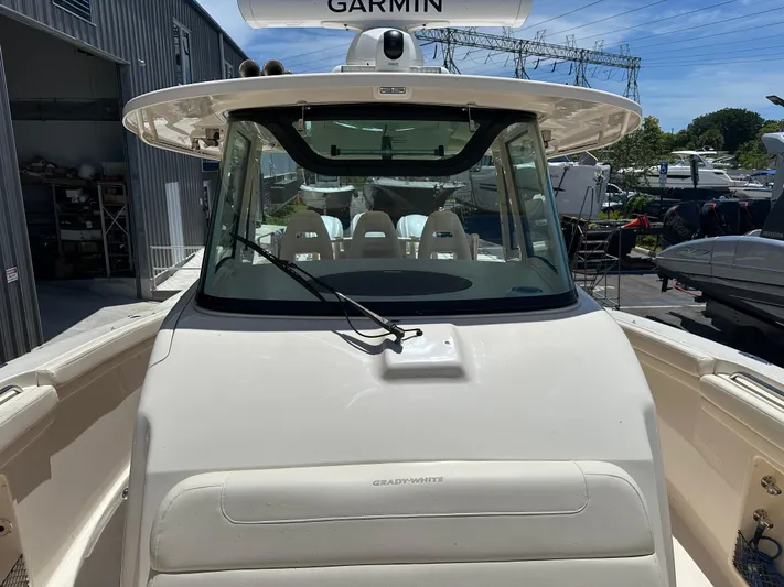  Yacht Photos Pics 2023 Grady-White Canyon 376 boat with Garmin equipment, docked outdoors.