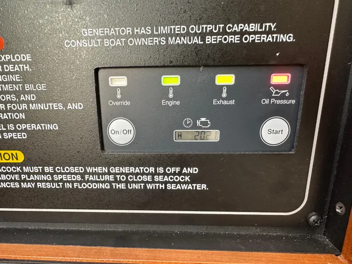  Yacht Photos Pics Control panel of 2023 Grady-White Canyon 376 boat generator with warning indicators.