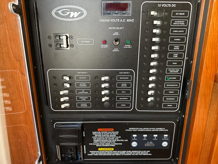  Yacht Photos Pics Electrical control panel of 2023 Grady-White Canyon 376 boat, featuring various switches and warnings.