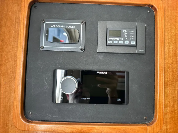  Yacht Photos Pics Control panel on 2023 Grady-White Canyon 376 boat with cooler and audio system.