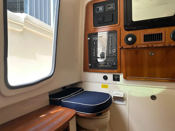  Yacht Photos Pics 2023 Grady-White Canyon 376 boat interior with control panel and seating area.