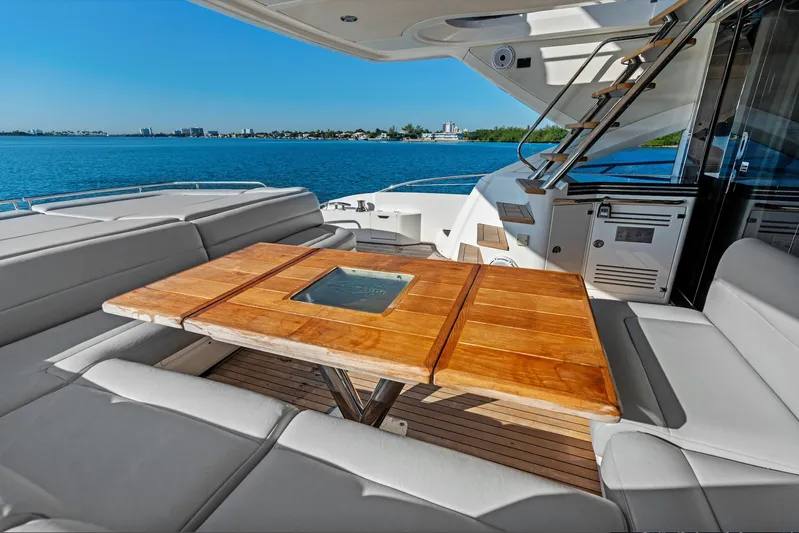Gem Yacht Photos Pics Luxurious Sunseeker 68 Sport Yacht 2014 with elegant deck seating and wooden table.