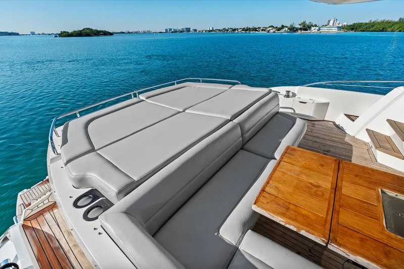 Gem Yacht Photos Pics Luxurious Sunseeker 68 Sport Yacht 2014 with spacious sunbathing area and wooden deck.