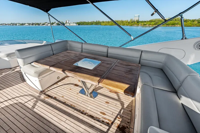 Gem Yacht Photos Pics Luxurious Sunseeker 68 Sport Yacht 2014 with elegant deck seating and scenic ocean view.