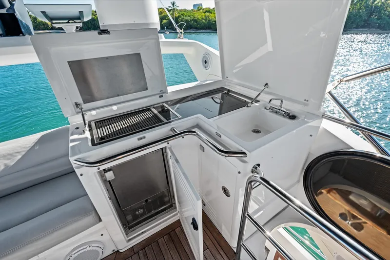 Gem Yacht Photos Pics Outdoor kitchen on 2014 Sunseeker 68 Sport Yacht with grill, sink, and storage.