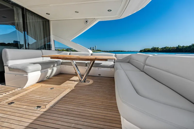 Gem Yacht Photos Pics Luxurious Sunseeker 68 Sport Yacht 2014 with elegant deck seating and scenic water view.