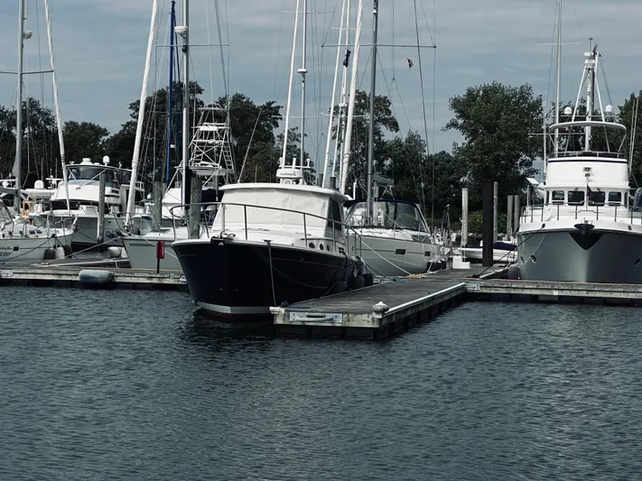 Someday Yacht Photos Pics 2012 Back Cove 34 yacht docked at a marina with other boats.
