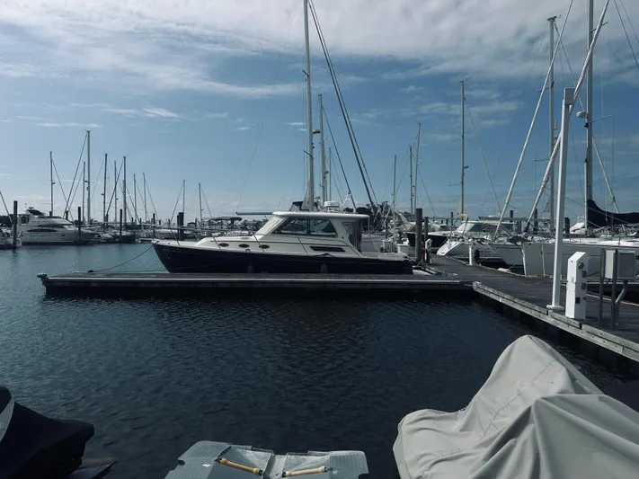 Someday Yacht Photos Pics 2012 Back Cove 34 yacht docked in a marina with sailboats.