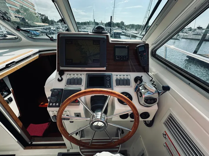Someday Yacht Photos Pics Helm of 2012 Back Cove 34 boat with navigation equipment and steering wheel.