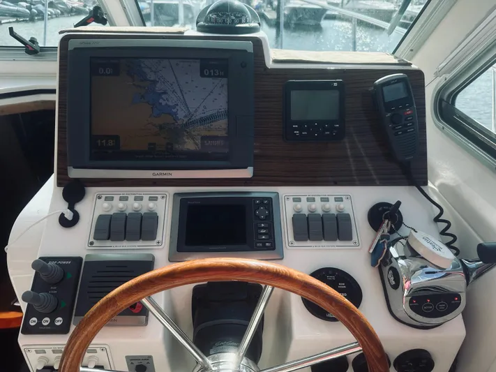 Someday Yacht Photos Pics 2012 Back Cove 34 helm with navigation equipment and wooden steering wheel.