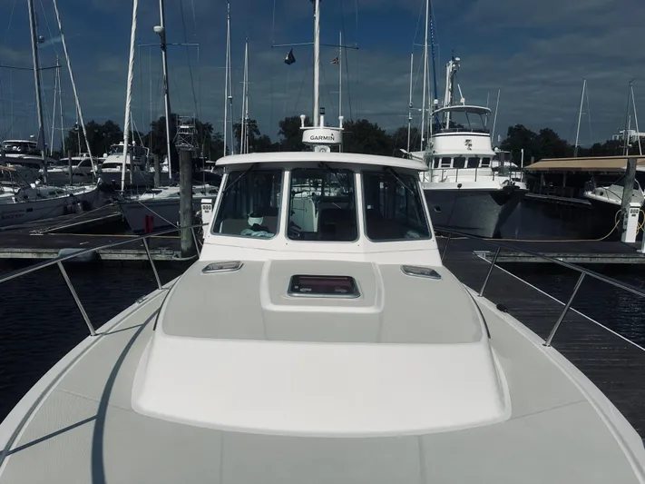 Someday Yacht Photos Pics 2012 Back Cove 34 boat docked at a marina with other vessels.
